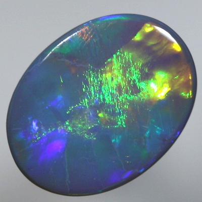 SOLID SEMI BLACK OPAL Large rolling flashes, neon orange to green